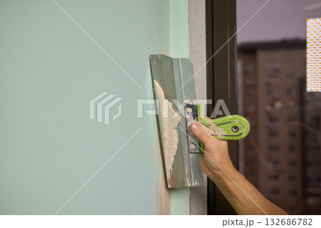 The Wall Repair Process Involves Properly Using Spackling Paste for a Quality Finish 132686782