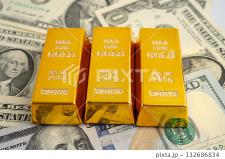 Gold bar on US dollar and Euro banknote, economy finance exchange trade investment. Gold bar on US dollar and Euro banknote, economy finance exchange trade investment. 132686834