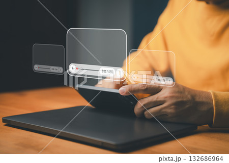 Streaming and online video concept. A person using a smartphone with media player interfaces, symbolizing digital content, social media, video streaming platforms and modern multimedia technology. Streaming and online video concept. A person using a smartphone with media player interfaces, symbolizing digital content, social media, video streaming platforms and modern multimedia technology. 132686964