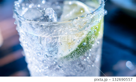 Extreme close-up macro view of clear, sparkling carbonated soda or water. Detailed bubbles and dramatic condensation drops emphasize the intense, refreshing coldness of the drink. AI Generated Extreme close-up macro view of clear, sparkling carbonated soda or water. Detailed bubbles and dramatic condensation drops emphasize the intense, refreshing coldness of the drink. AI Generated 132690557