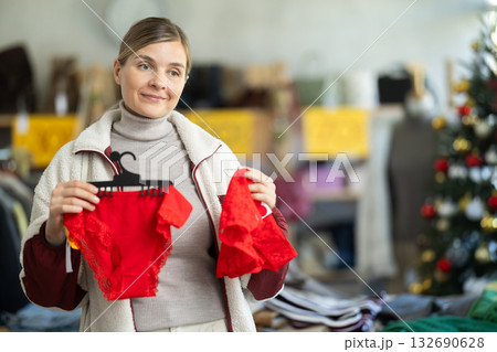 Woman buying red panties for the new year 132690628