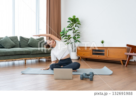 Young Asian woman stretching yoga workout on exercise mat 132691988