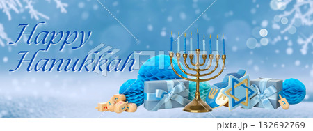 Menorah with blue candles surrounded by gifts and decorations Menorah with blue candles surrounded by gifts and decorations 132692769