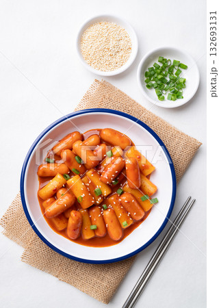 Korean Tteokbokki (simmered rice cake) and sausage with spicy sauce Korean Tteokbokki (simmered rice cake) and sausage with spicy sauce 132693131