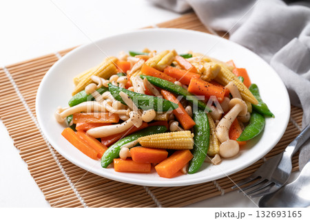 Stir fried vegetables, Green pea, Carrot, Baby corn and Shimeji mushroom with soy sauce Stir fried vegetables, Green pea, Carrot, Baby corn and Shimeji mushroom with soy sauce 132693165