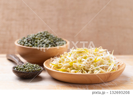 Mung bean sprouts and seeds on wooden background, Food ingredient in Asian cuisine 132693208