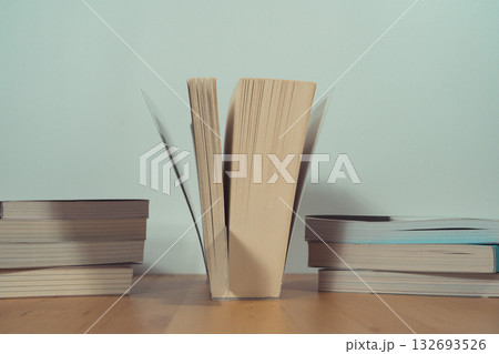 stack of book on table with soft focus library or bookstore background stack of book on table with soft focus library or bookstore background 132693526