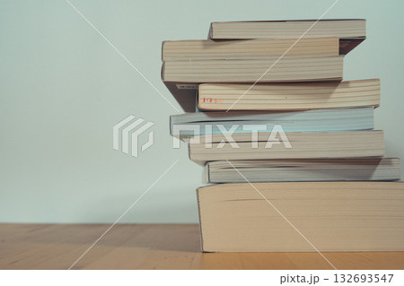 stack of book on table with soft focus library or bookstore background stack of book on table with soft focus library or bookstore background 132693547