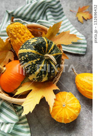 Assorted pumpkins gourds and autumn leaves celebrating fall harvest Assorted pumpkins gourds and autumn leaves celebrating fall harvest 132696432