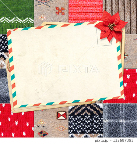Letter to Santa Claus. Christmas background with retro postcard and poinsettia on wool sweater texture. Nostalgic holiday backdrop with cozy knitted wool material and vintage card. Copy space for text Letter to Santa Claus. Christmas background with retro postcard and poinsettia on wool sweater texture. Nostalgic holiday backdrop with cozy knitted wool material and vintage card. Copy space for text 132697383