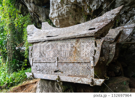 Carved cave tombs in a Toraja sanctuary, Sulawesi, Indonesia Carved cave tombs in a Toraja sanctuary, Sulawesi, Indonesia 132697964