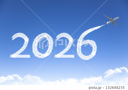 Happy New year 2026 concept travel on the background below cloudscape. Drawing by passenger airplane vapor contrail in sky. 132698235