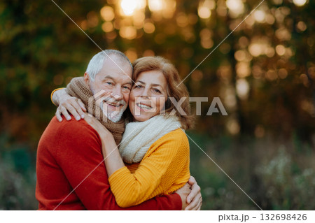 Portrait of senior couple in autumn nature. 132698426