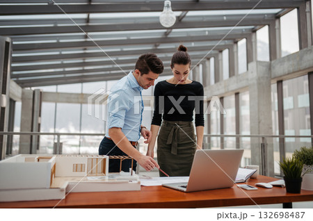 Portrait of two managers in modern office. 132698487