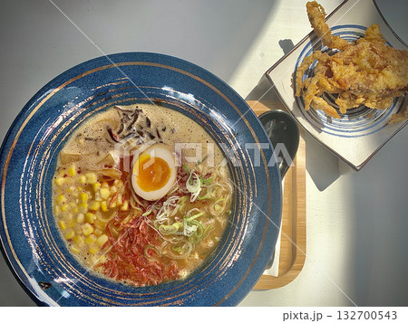 Japanese ramen noodles, with half egg, corn, vegetable and fried crab from top view Japanese ramen noodles, with half egg, corn, vegetable and fried crab from top view 132700543