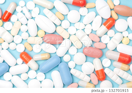Various pills flat lay, top view on blue background, healthcare, medication, pharmacy, and medical concept 132701915