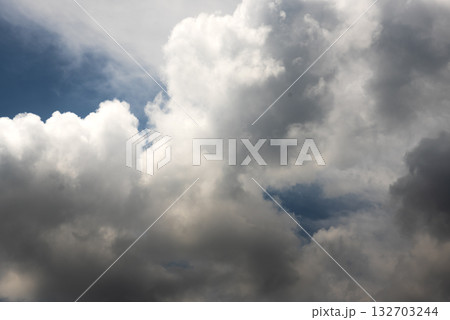 Dramatic dark storm rain clouds black sky background. Dark thunderstorm clouds rainny atmosphere. Meteorology danger windstorm disasters climate. Dark cloudscape storm disaster gloomy gray cloud sky Dramatic dark storm rain clouds black sky background. Dark thunderstorm clouds rainny atmosphere. Meteorology danger windstorm disasters climate. Dark cloudscape storm disaster gloomy gray cloud sky 132703244