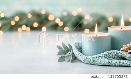 Relaxing ambiance with lit candles on soft fabric in serene setting with blurred background 132705278