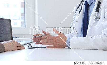 Doctor gesturing with hands while explaining diagnosis to patient during medical consultation in hospital office, healthcare and medical concept. Medicine Doctor gesturing with hands while explaining diagnosis to patient during medical consultation in hospital office, healthcare and medical concept. Medicine 132706015