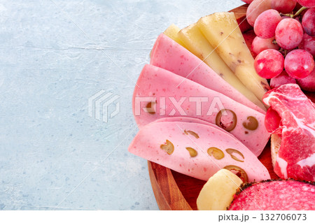 Italian Antipasti close-up. Charcuterie platter with Bologna ham, cheese etc 132706073