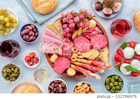 Italian Antipasti. Charcuterie platter with cheese and other snacks 132706079