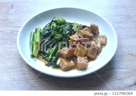 fried Kailaan Chinese kale and dice tofu dressing soy sauce vegetarian food on plate 132706569