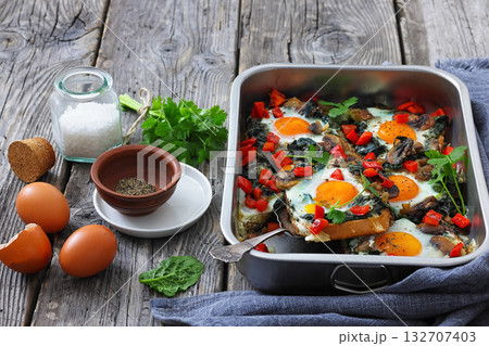 baked eggs with spinach, mushroom, sweet pepper baked eggs with spinach, mushroom, sweet pepper 132707403