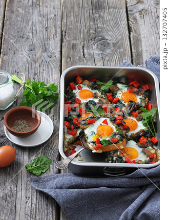 baked eggs with spinach, mushroom, sweet pepper baked eggs with spinach, mushroom, sweet pepper 132707405