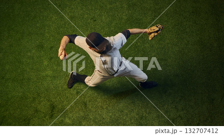 Baseball pitcher top view throwing motion with rotational power and arm extension. Baseball pitcher top view throwing motion with rotational power and arm extension. 132707412