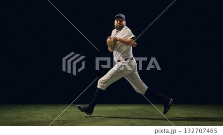 Baseball pitcher mid-stride transition phase before throw showing ground reaction control Baseball pitcher mid-stride transition phase before throw showing ground reaction control 132707465