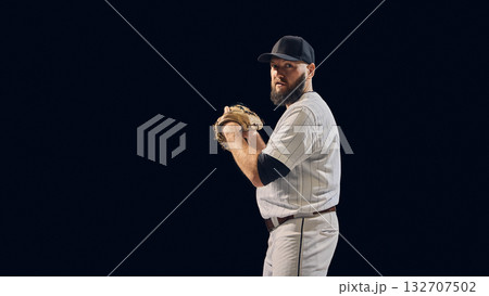 Baseball pitcher holding ball in set position showing grip and throwing posture Baseball pitcher holding ball in set position showing grip and throwing posture 132707502
