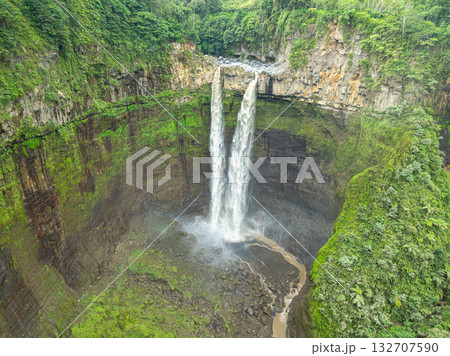 Aerial view The twin waterfalls flowing down large cliffs are unusually beautiful. Aerial view The twin waterfalls flowing down large cliffs are unusually beautiful. 132707590