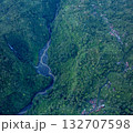 Aerial view The waterfall stream flows into the mountain gorge in a long path. 132707598