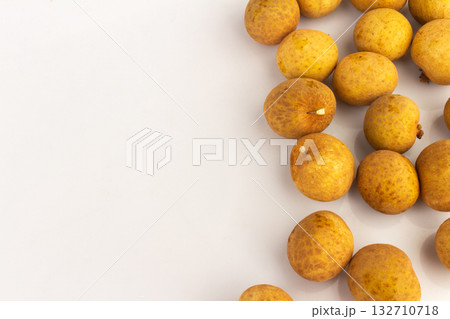 Longan Fruits Scattered and Piled on White Background Longan Fruits Scattered and Piled on White Background 132710718