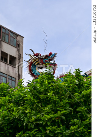 Close-up of the ornate decor on the Mengjia Longshan Temple in Taipei, Taiwan. Chinese folk religion landmark. Buddhist Temple. Religious and traditional Chinese art.  132710752