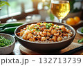 Bowl of food with rice and meat, and a glass of wine 132713739