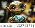 Small alien holding a ball in its hand 132713741