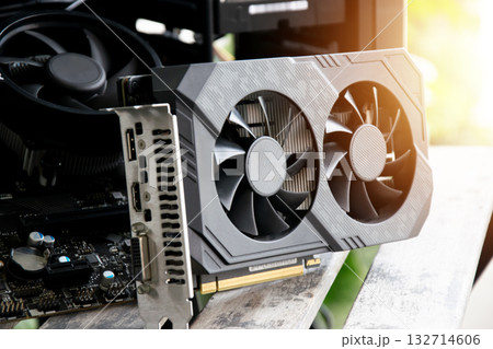 Side view of the motherboard and graphics card are the main components of the computer. Side view of the motherboard and graphics card are the main components of the computer. 132714606