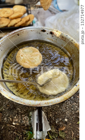 Hand frying pastries. High quality photo Hand frying pastries. High quality photo 132714977