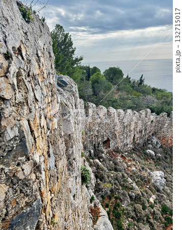 stone wall ruins mountain sea horizon cloudy. High quality photo stone wall ruins mountain sea horizon cloudy. High quality photo 132715017