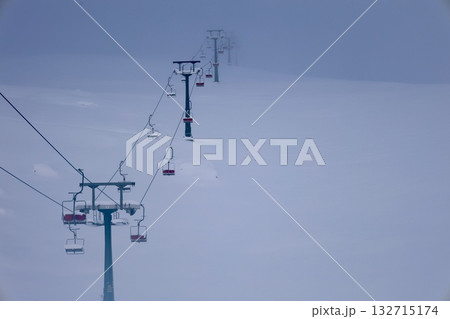 Snowy mountain ski-lift no people, blue sky, azure, air, freshness, ecology. High quality photo Snowy mountain ski-lift no people, blue sky, azure, air, freshness, ecology. High quality photo 132715174