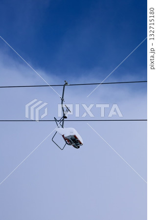 Snowy mountain ski-lift no people, blue sky, azure, air, freshness, ecology. High quality photo Snowy mountain ski-lift no people, blue sky, azure, air, freshness, ecology. High quality photo 132715180