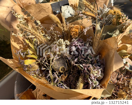 Rustic dried bouquet with grains and wildflowers. Natural composition, autumn mood and earthy handmade elegance. Rustic dried bouquet with grains and wildflowers. Natural composition, autumn mood and earthy handmade elegance. 132715241