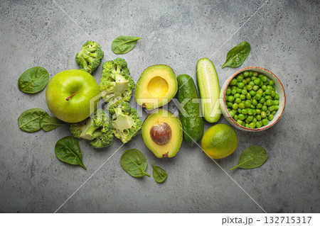 Fresh green vegetables and fruit grey concrete background top view, diet, vegetarian 132715317