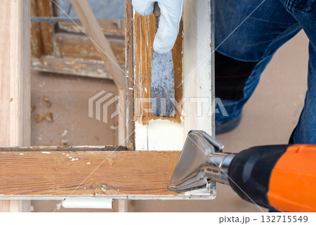Carpenter at work, restoring an old wooden window. Carpentry. Carpenter at work, restoring an old wooden window. Carpentry. 132715549