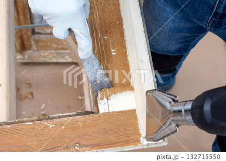 Carpenter at work, restoring an old wooden window. Carpentry. Carpenter at work, restoring an old wooden window. Carpentry. 132715550