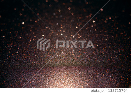 Bronze glitter texture glowing below with luminous bokeh above forming radiant abstract surface 132715794