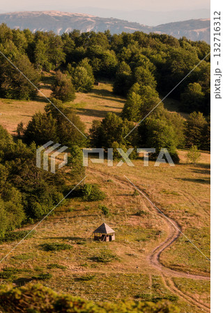 Scenic Rural Landscape with Hiking Trail and Hut Scenic Rural Landscape with Hiking Trail and Hut 132716312
