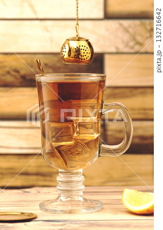 Tea mug and teapot on a wooden table Tea mug and teapot on a wooden table 132716642