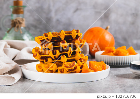 Sweet baked pumpkin waffles on a plate on the table 132716730